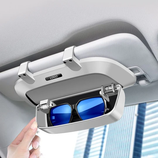 Smooth Damping Mechanism: Open and close the case effortlessly with its gentle damping design, ensuring a smooth and quiet operation. Protective Flocked Interior: The soft, flocked lining provides a gentle cushion for your glasses, preventing scratches and keeping them in pristine condition. Universal Fit: Compatible with any car model, this case ensures that your sunglasses are always within reach, no matter what vehicle you're driving. Preserves Sun Visor Functionality: Attach it to your sun visor without compromising its ability to shield you from glare, so you can drive safely and comfortably. Smooth Damping Mechanism: Open and close the case effortlessly with its gentle damping design, ensuring a smooth and quiet operation. Protective Flocked Interior: The soft, flocked lining provides a gentle cushion for your glasses, preventing scratches and keeping them in pristine condition. Universal Fit: Compatible with any car model, this case ensures that your sunglasses are always within reach, no matter what vehicle you're driving. Preserves Sun Visor Functionality: Attach it to your sun visor without compromising its ability to shield you from glare, so you can drive safely and comfortably.