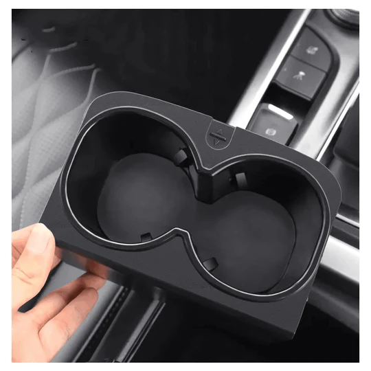 Central Control Water Cup Pad for GWM TANK 300 Compatible with GWM TANK Cup Holder: Specially designed for TANK 300, which fits perfectly and seamlessly, looks like a real part of the car. High-quality Material: The car cup holder Insert is made of TPE soft rubber material, which is sturdy and durable, non-toxic and tasteless. Easy to Clean: If the cup holder is accidentally soiled, it can be easily removed and washed with water, and then wiped clean with a towel or paper towel. The service life will not change. Easy to Install: No need to paste and drill. When using, unfold the cup holder to both sides and repeat several times, with the sides slightly lower at the front and slightly higher at the back, and then directly insert the original cup holder. When not in use, you can directly remove it, very easy to use.